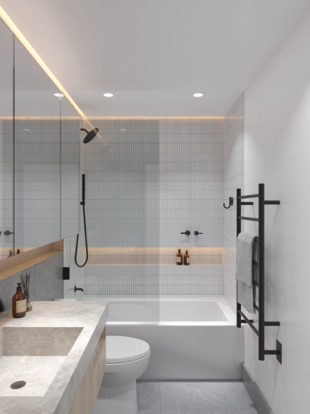 Minimalist small bathroom with tub, modern lighting, wooden details, and grey tiles.