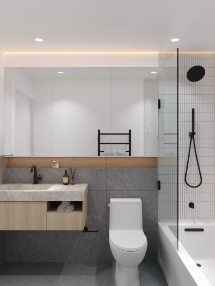 Elegant small bathroom with floating vanity, shower, and subtle lighting design by Studium Dekor.