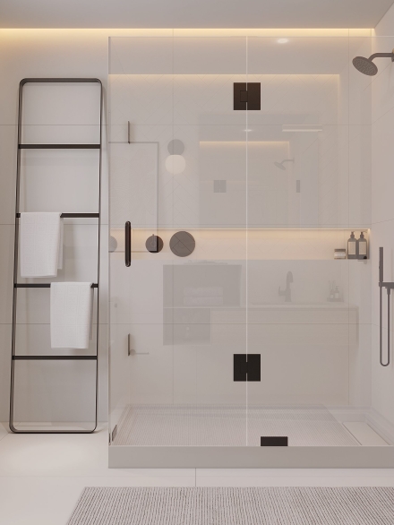 Small and modern white bathroom tiled in white chevron tiles and frameless shower enclosure by Studium Dekor.