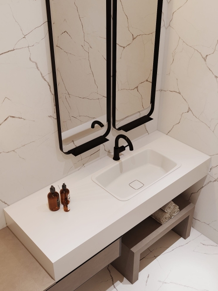 Small powder room with italian vanity unit cladded in marble porcelain tiles and metal frame mirrors by Studium Dekor.