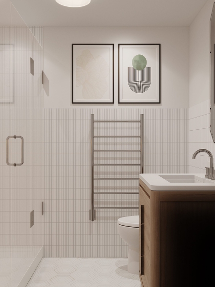 Modern small bathroom with tiled shower, wooden vanity, towel warmer, and framed abstract art on the wall by Studium Dekor.