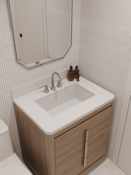 Small bathroom with a wooden vanity, white countertop, mirrored cabinet, and mini subway tiles by Studium Dekor.