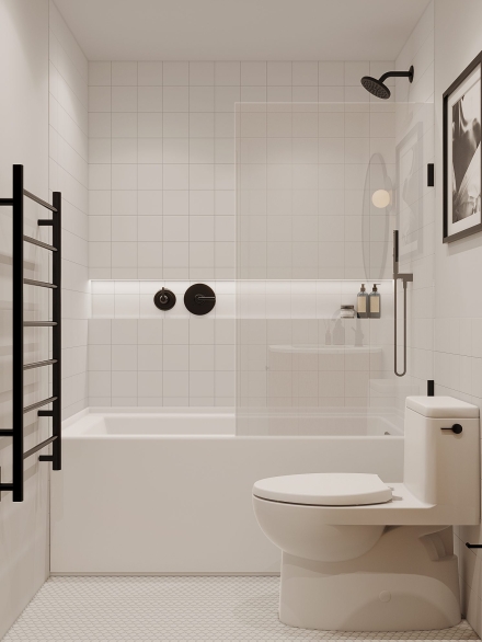Clean and modern bathroom design with a shower above the bath, ladder towel rack, white toilet, and a framed picture by Studium Dekor.