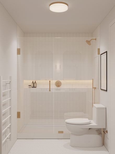 Modern small bathroom layout cladded in white metro tiles featuring a frameless shower screen in brass details by Studium Dekor.