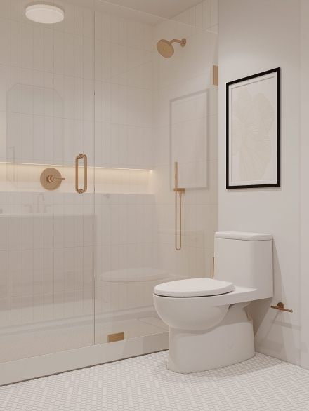 Modern small bathroom layout cladded in white metro tiles featuring a frameless shower screen in brass details by Studium Dekor.
