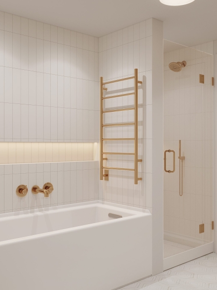 Bright small bathroom with a soaking tub, heated towel ladder, and elegant gold shower fixtures.