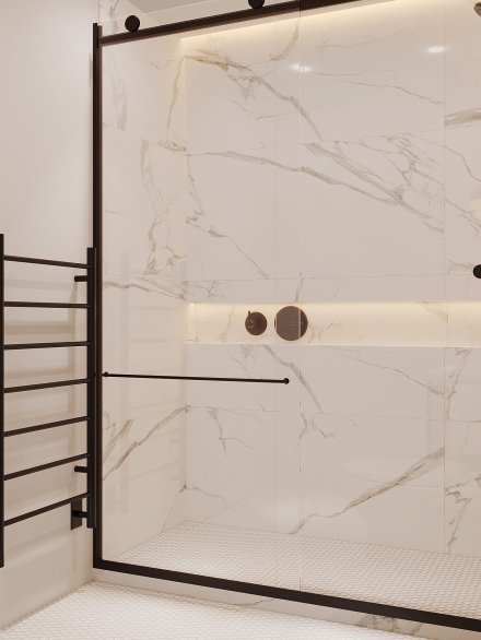 Modern bathroom with metal shower door frame and black metal heated towel rail by Studium Dekor.